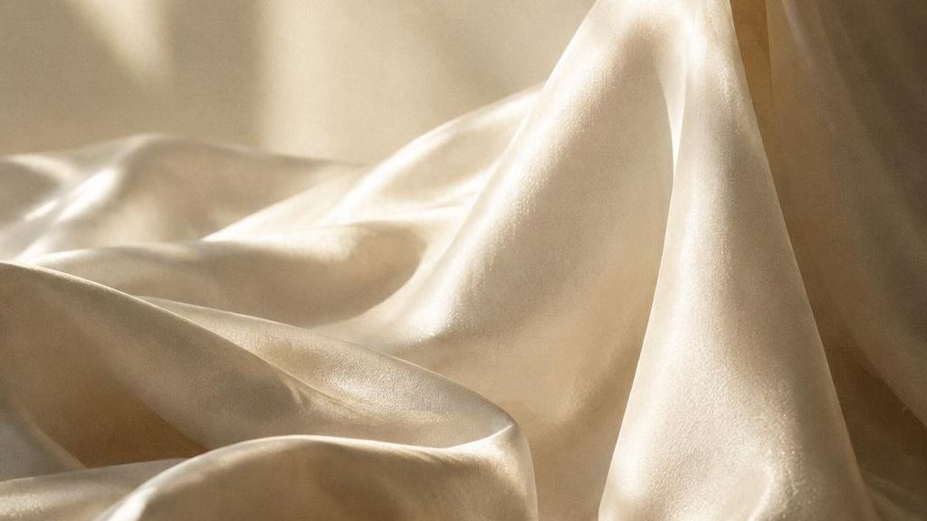 Silk caught mid-air in warm directional light